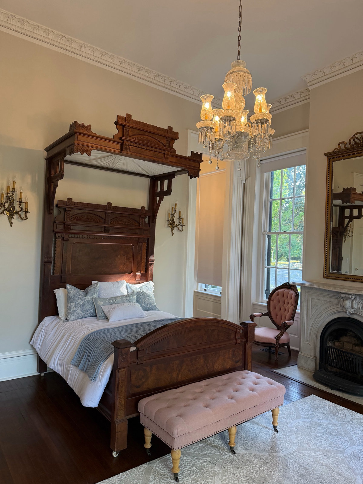 Julia Suite full-size canopy bed and antique-furnished bedroom at The Walter Place